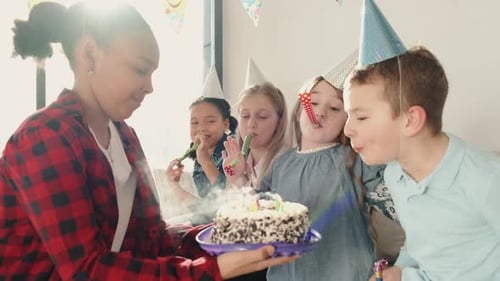 Children Celebrating Birthday, Blowing Out Candles Together