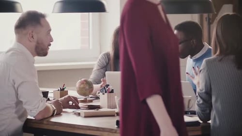 African American Businessman Speaking at Multiethnic Office Team