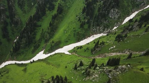 Aerial View Snow Mountain Glacier in the Summer Mountains