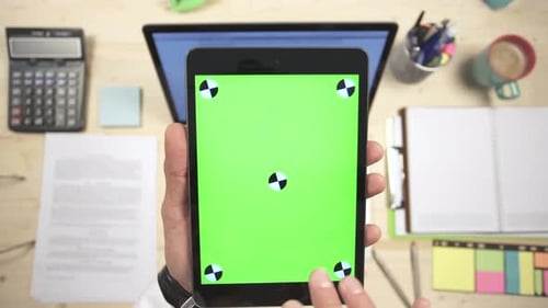 Hands Using Tablet with Greenscreen Display
