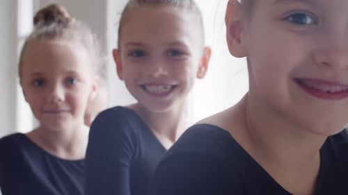 Happy Little Girls Smiling Lovingly Together Indoors