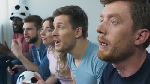 Friends Watching Sports Event Together at Home