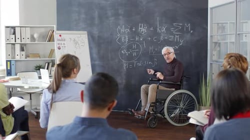 Teacher Giving Lecture to Class in Classroom