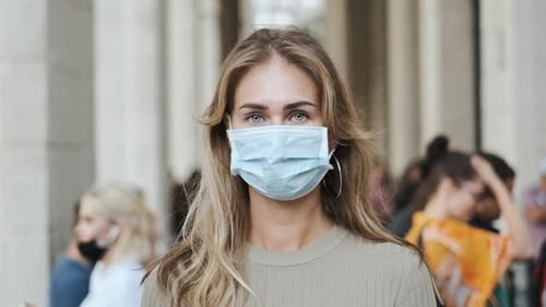 Young Woman Wearing Mask in Urban Environment
