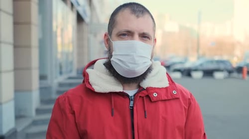 Man Wearing Face Mask Outdoors in City