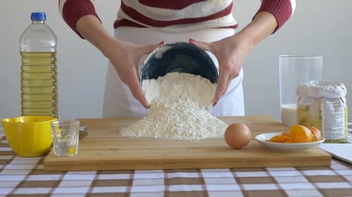 Woman Pouring Flour for Baking at Home