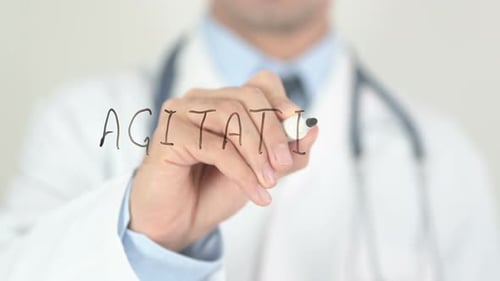 Doctor Writes 'Agitation' on Transparent Screen