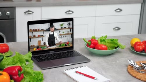 Vegetables and Laptop in Kitchen with Cooking Video