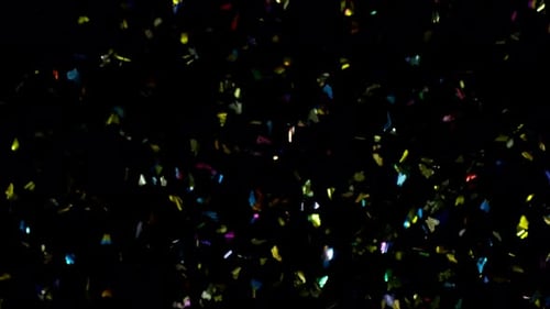 Abstract Colorful Confetti Falling on Black Background