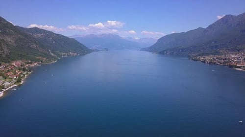 Aerial Flying Over Mountain Lake Como in North of Italy, Lot of Lakeside Villages, Sunny Weather