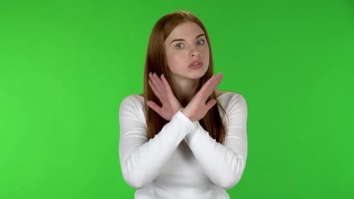 Auburn Haired Woman Gesturing No on Green Screen