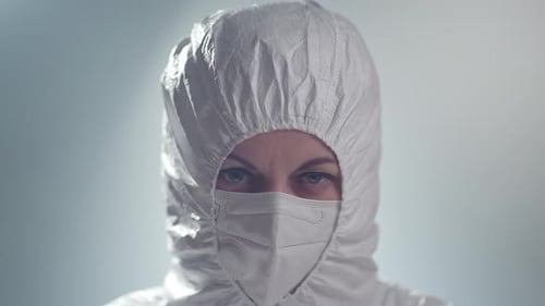 Close Up of Health Worker in Protective Suit