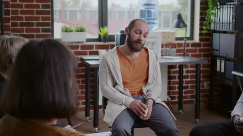 Man Cries During Therapy Session Support Group