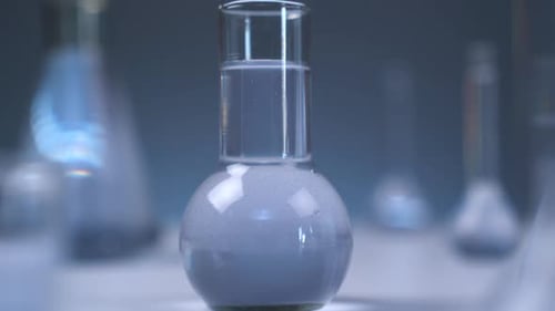 Close up laboratory glassware with chemical compounds
