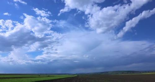 Rural Landscape With Green Grass Field And Blue Sky