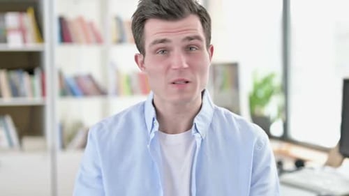 Young Adult Talking and Gesturing Indoors