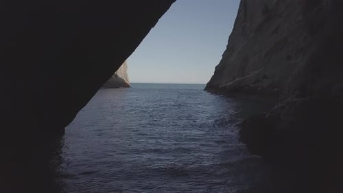 Dramatic Coastal Rock Formations and Sea Caves by Drone
