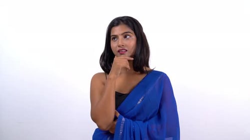 Young Woman Posing Thoughtfully in a Blue Saree