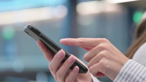 Close up of Hands of Woman Using Smartphone