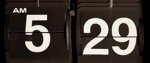 Mechanical Flip Clock Ticking Through AM Time