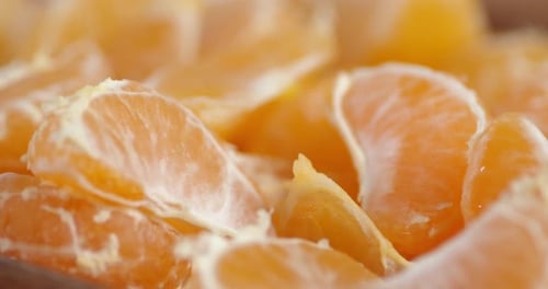 Pieces of Mandarin Rotate Slowly.