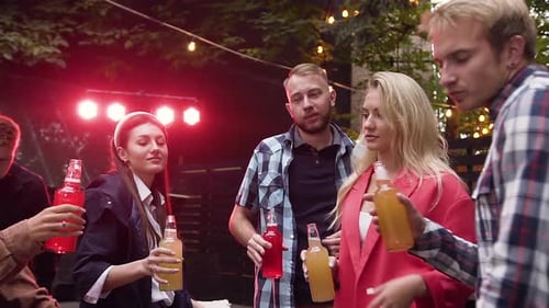 Friends Toasting Drinks at Urban Outdoor Gathering
