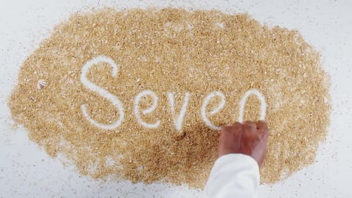 Escribe a mano en Sand Seven