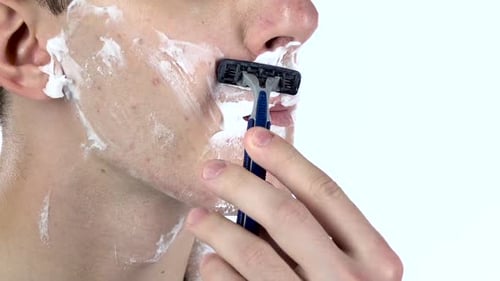 Guy Is Shaving His Face Under Nose. Slow Motion. Close-up