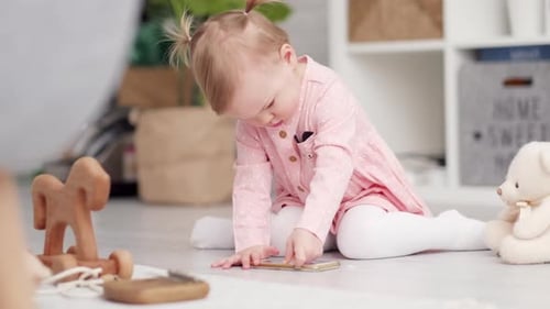 Eco Wood Toy Baby Game Little Clever Caucasian Child Playing Natural Toys on Floor at Home