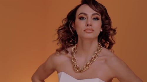 Woman Posing with Gold Chain Necklace