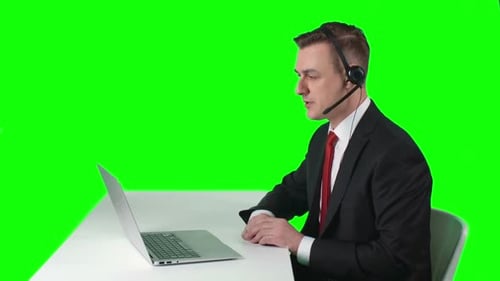 Man in Suit Discussing Technology on a Video Call