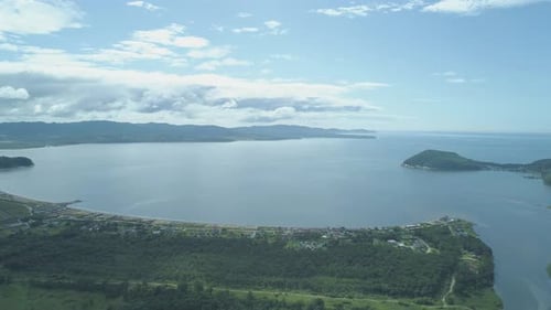 Aerial Shot Over the Bay in Summertime with Turquoise Water on Unny Day