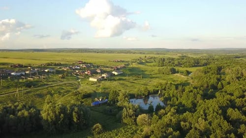 Aerial View of Village Landscape with Lush Forests