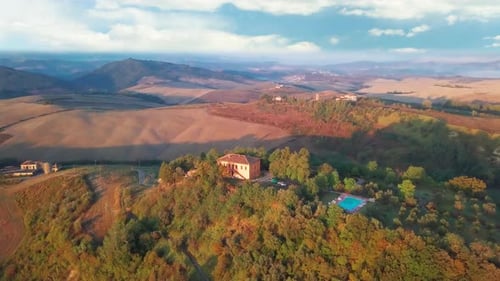Aerial Flyover the Beautiful Sunset Landscape in Tuscany Italy