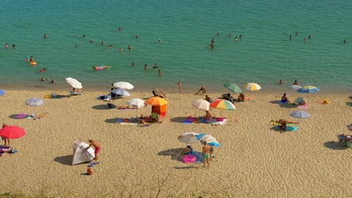 People enjoying summer vacation on the coast, Greece