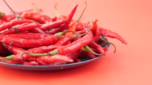 Vibrant Red Chili Peppers on a Plate