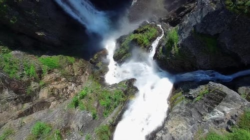 Breathtaking top-down aerial view of Voringfossen waterfall in Norway.