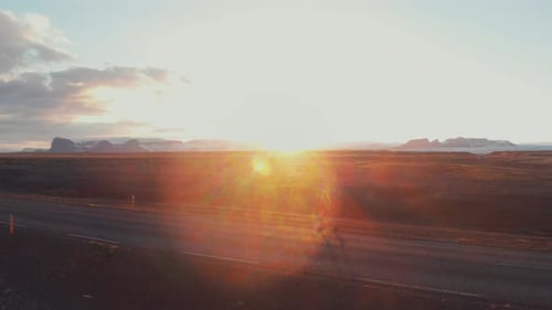 Traveling woman running on remote road