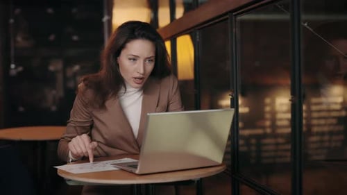 Young Woman Talking on Video Call in Office