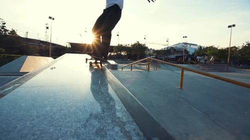 Skateboarder Performing Trick on Skate Ramp