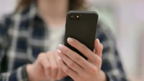Close Up of Female Hands Using Smartphone