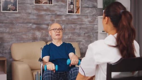 Senior Man Exercising with Healthcare Professional at Home