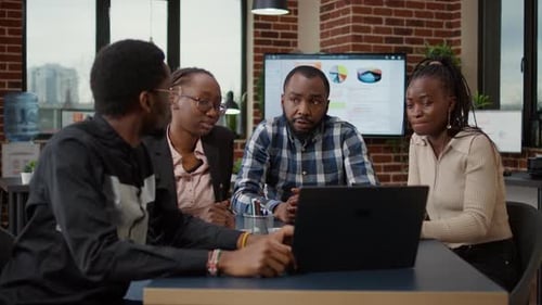 Team Discussing Business Strategy in Modern Office