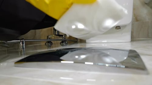 Cleaning Marble Surface in Bathroom