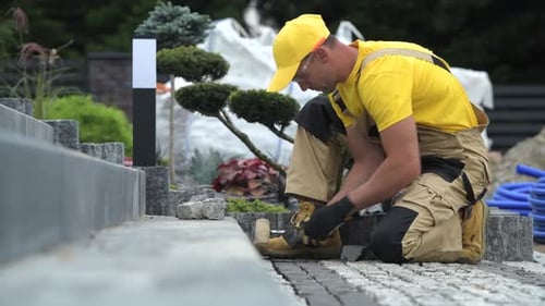 Construction Worker Building Brick Path