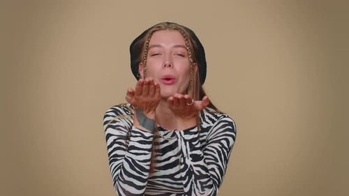 Smiling Romantic Pretty Girl Sending Air Kisses Looking at Camera and Smiling Missing you Love