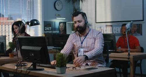 Man Helping Out His Colleague at an Office