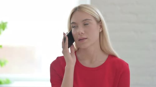 Young Woman Talking on Smartphone
