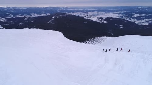 Fly over snowboarders