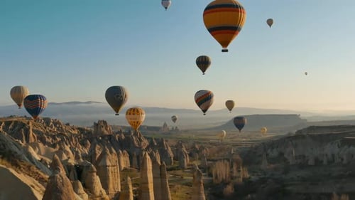Hot Air Balloons Soar Over Cappadocia Landscape